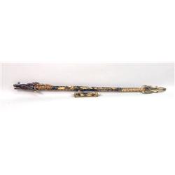 AN INDONESIAN NAGA-FORM CARVED BONE BLOWGUN