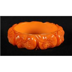 Bakelite Orange Deeply Carved Lilly Pad Bracelet.