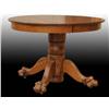 Image 1 : Oak Round Table with Claw Feet.