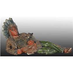 Reclining Indian Figure Holding Pipe.