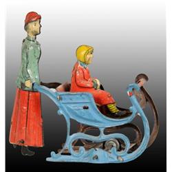 Tin Woman Pushing Girl in Sled Penny Toy.