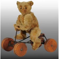 Early Steiff Teddy Bear on Toy Bicycle.