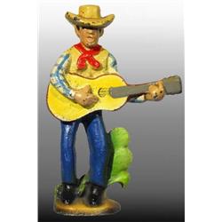Cast Iron Cowboy with Guitar Bottle Opener.