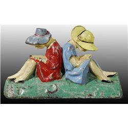 Cast Iron Girls Reading Doorstop.
