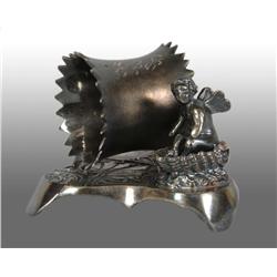 Winged Cherub in Shell Boat Figural Napkin Ring.