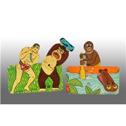 Lot of 2: Tin Tarzan & Africa Clicker Toys.