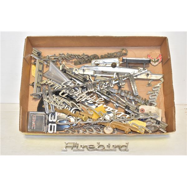 FLAT OF AUTO BADGES AND CHROME PIECES