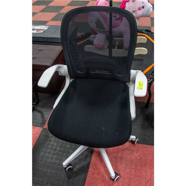 NEWLY ASSEMBLED BLACK AND WHITE OFFICE CHAIR