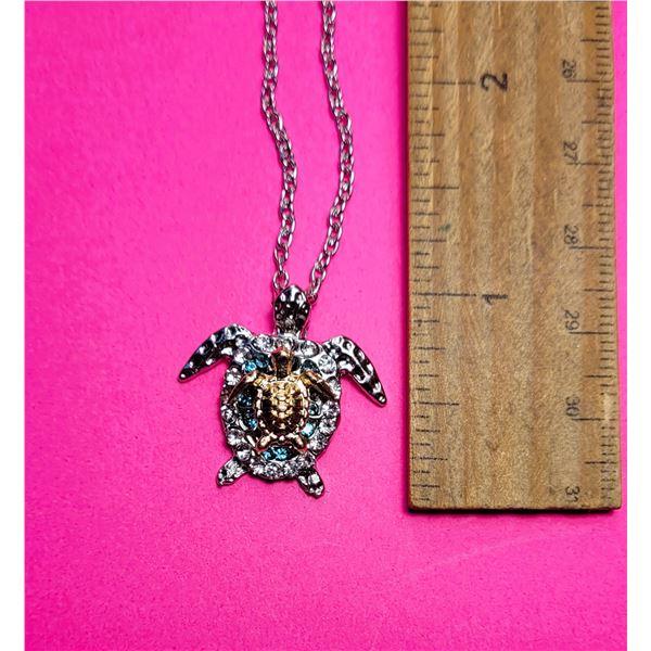 30)  SILVER TONE WITH GOLD BABY AND CLEAR