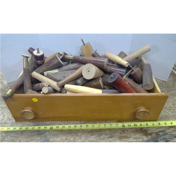 Drawer full of assorted furniture legs