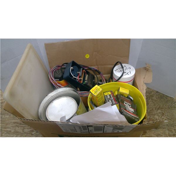 Box of assorted fasteners, cutting board, saw blades, hinges ,battery and charger