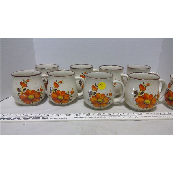 8 floral mugs and cream pot