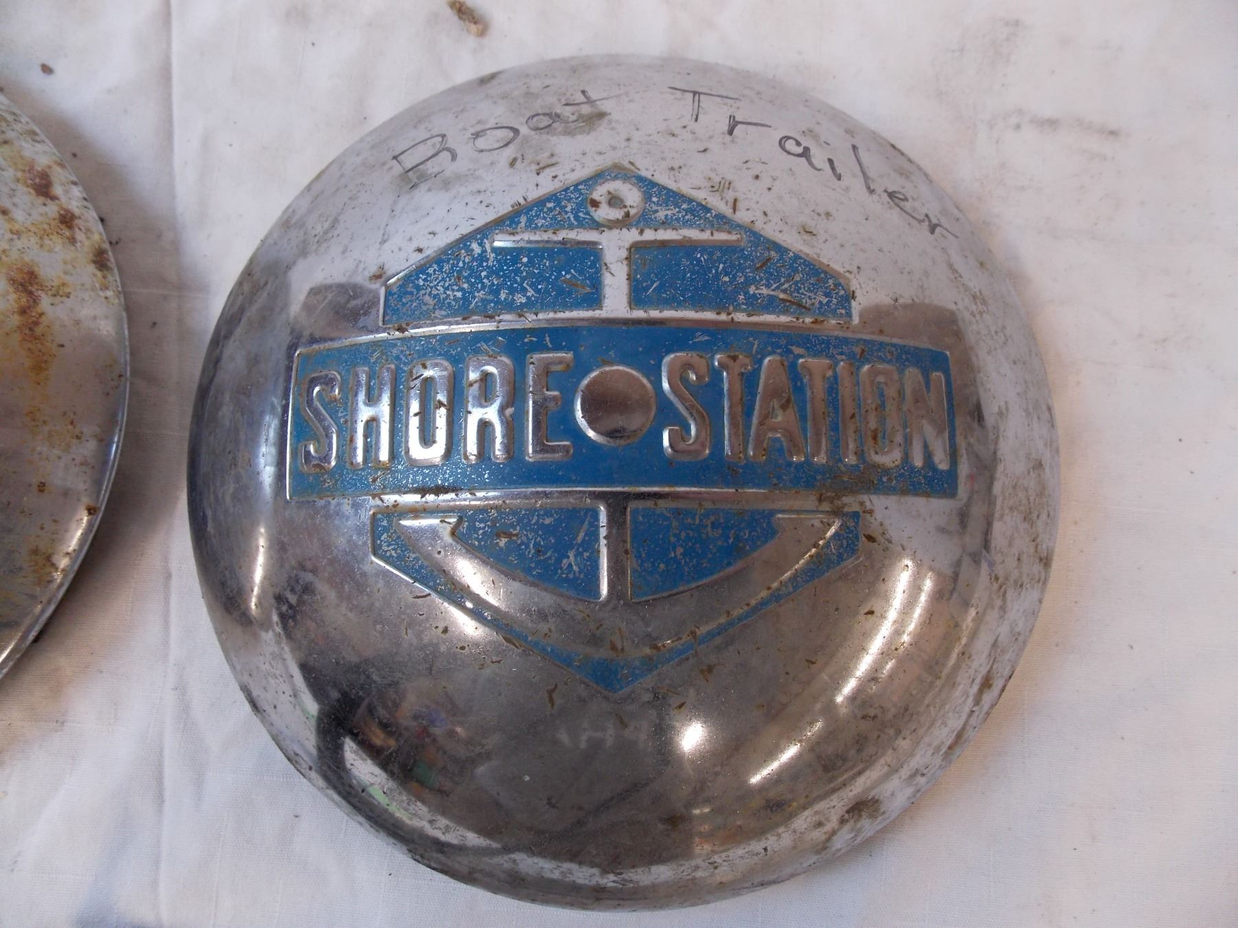 Pair of boat trailer hub caps Bodnarus Auctioneering