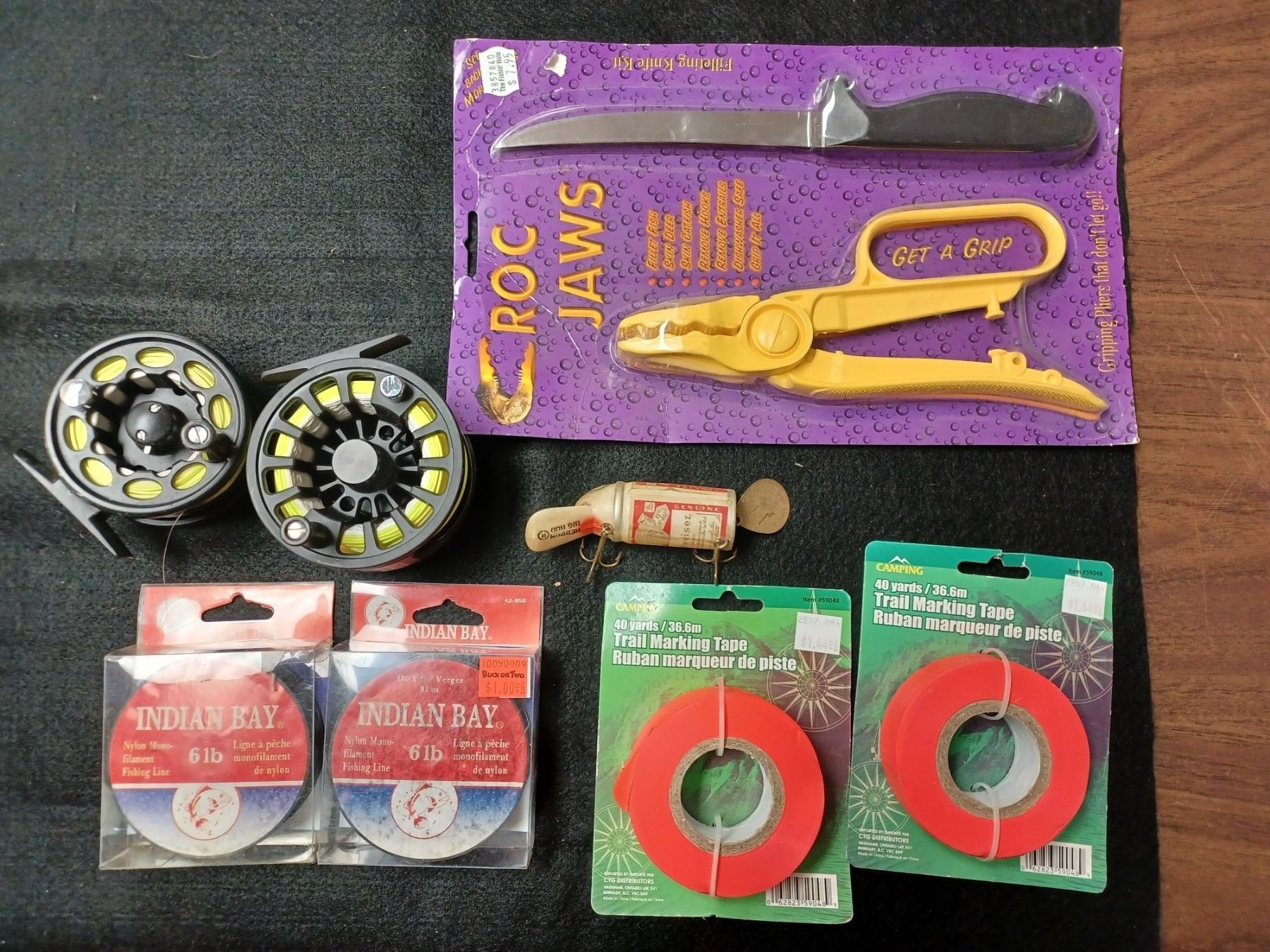 TWO FLY FISHING REELS WITH LINE, TWO ROLLS OF FLAGGING TAPE, BEER CAN ...