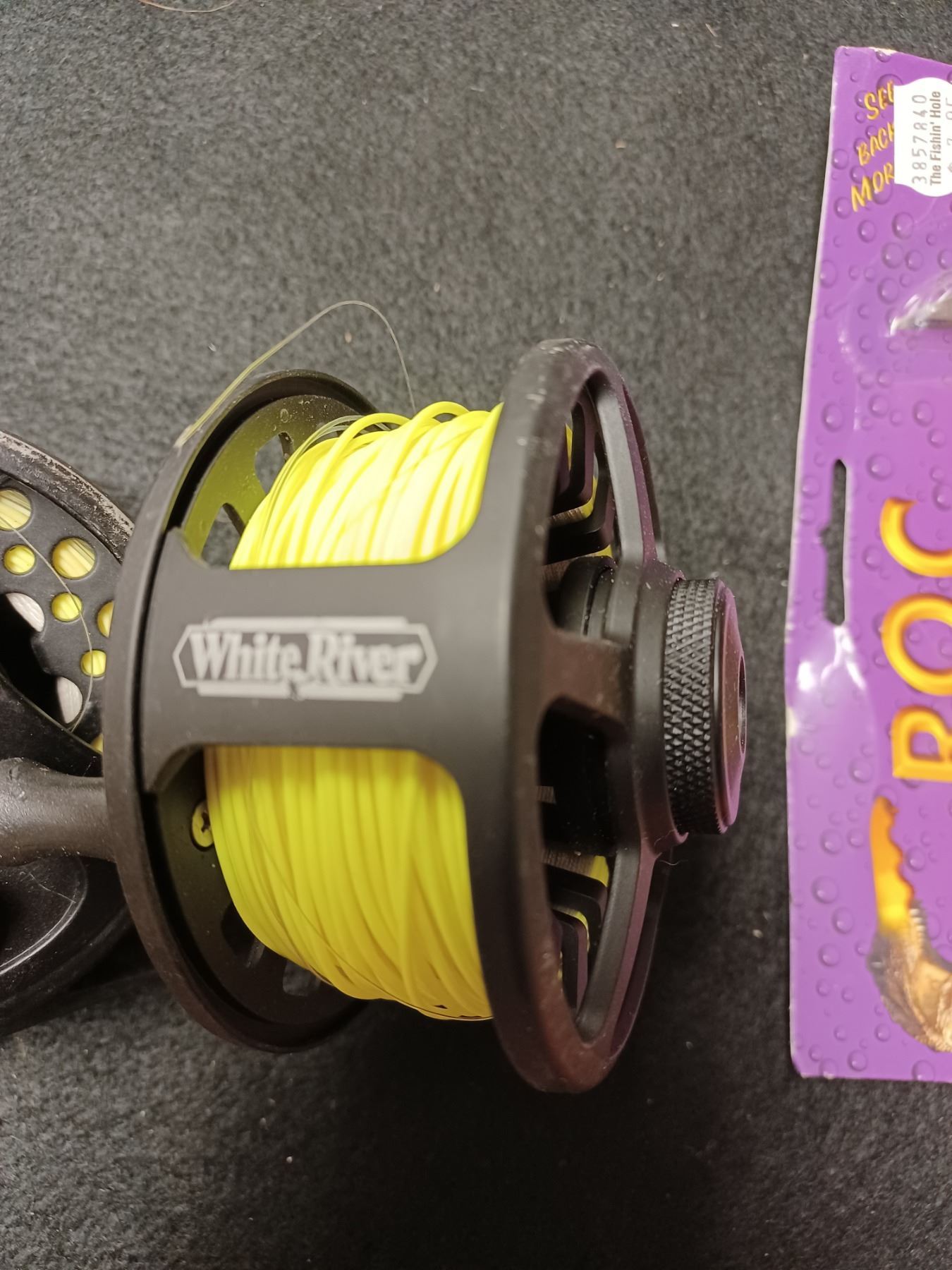 TWO FLY FISHING REELS WITH LINE, TWO ROLLS OF FLAGGING TAPE, BEER CAN ...