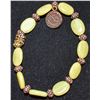 Image 1 : YELLOW JADE BRACELET WITH COPPER TONE SPACERS