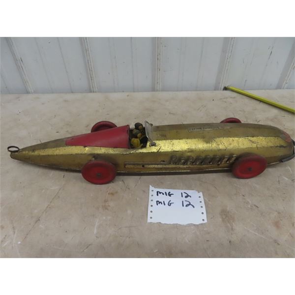 1920 Buffalo Silver Bullet Pressed Metal Racecar with pull out wind up working gold in color 26" lon