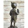 Image 8 : Boy Lighting up Bronze Statue