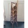 Image 1 : Wicker wine bottle rack or bathroom rolled towel holder.