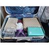 Image 8 : Vintage Riviera suitcase filled with Avon samples, cosmetic bags, colognes, massager etc.