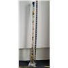 Image 1 : Tall 31”unique rose vase filled with assortment of marbles.