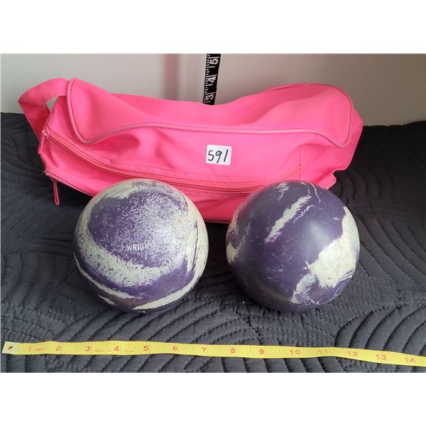 Set of 2 purple and tan 5 pin bowling balls in pink carry bag.