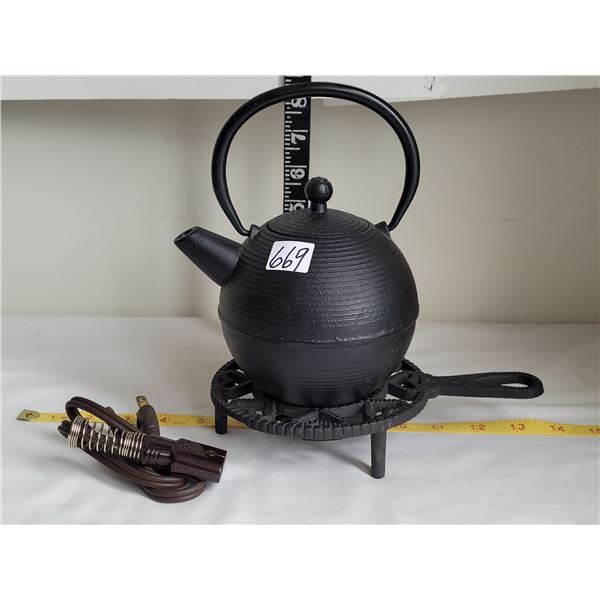 Cast iron electric warmer with cast iron tea pot.