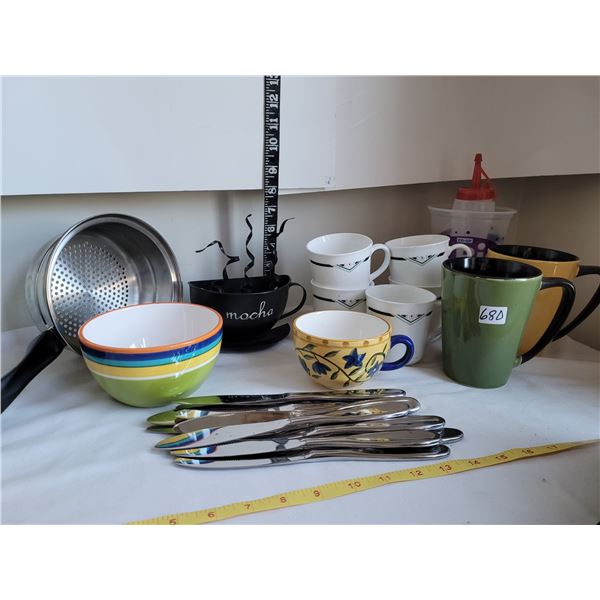 Metal Mocha wall decor with assorted coffee mugs, silverware etc.