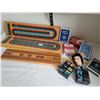 3 cribbage boards, one made in New Zealand from native timber. 6 decks of cards, 3 rubik type puzzle