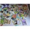 Image 3 : Pokemon collector tin with over 125 unchecked cards.