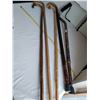 Image 2 : 4 old wood canes & 1 adjustable metal cane.