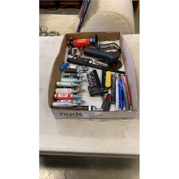 TRAY OF CO2 CANNISTERS, CIGAR CUTTER, TORCHES, MULTI TOOL, THROWING STARS