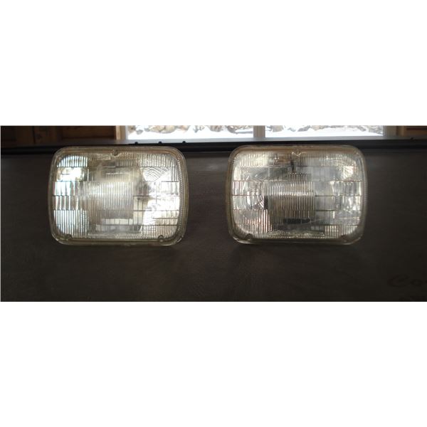pair vintage headlamps