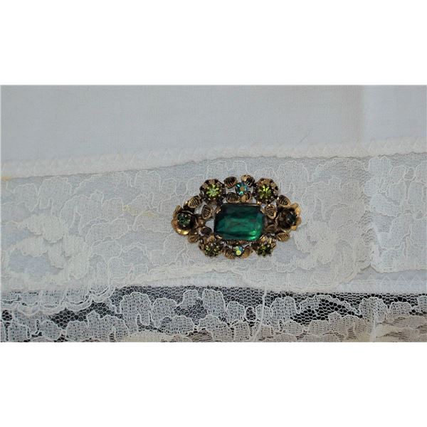 Moss and Emerald coloured brooch