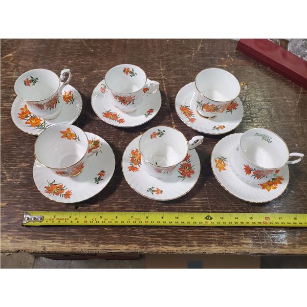 Prairie Lilly china cups and saucers (one cup broken)