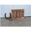 Mounted antique tools and horse shoes