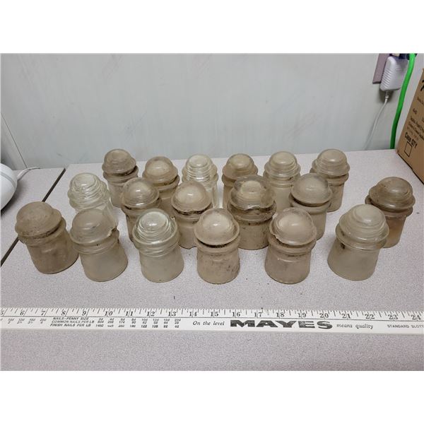 Large lot of clear glass insulators, some stamped 'Dominion'