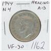 Image 1 : Canadian 1944 Near 4 Hearing Aid Silver 50 Cents. Coin displays a Hearing Aid in the King’s ear, the