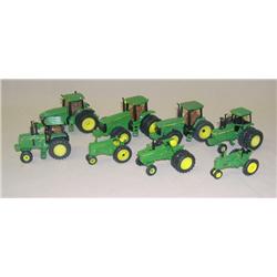 (8) JD 1/64th Tractors