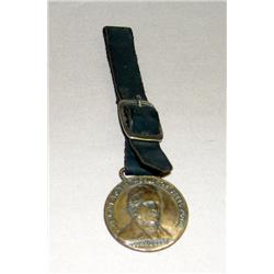 Original JD Centennial Watch fob w/ Covered Wagon on reverse Side