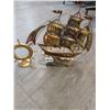 Image 1 : Wind-up Rocking & Musical Brass Ship 12"h x 12"l with Brass Ships Wheel