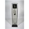 Image 1 : A Howard Miller style chrome and plexiglass clock,