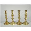 Image 1 : A group of four 19th Century brass candlesticks.