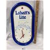 Image 1 : Labatts Lite Battery Operated Wall Clock 20 x 10" Small Chip Near Bottom