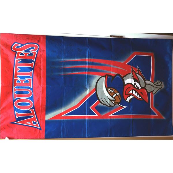 Alouettes flag, autographed by several players in the years 2010 and more.