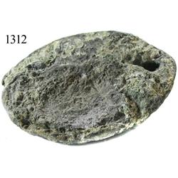 Oval-shaped lead ingot.