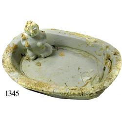 Porcelain soapdish(?) with squatting figure.