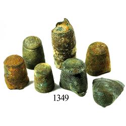 Lot of 6 brass sailmakers' thimbles and clump of several more.