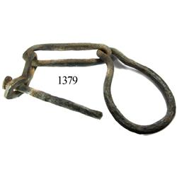 Iron anchor chain snubber and pin.