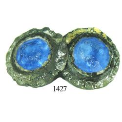 Base-metal cufflink with blue-glass stones.